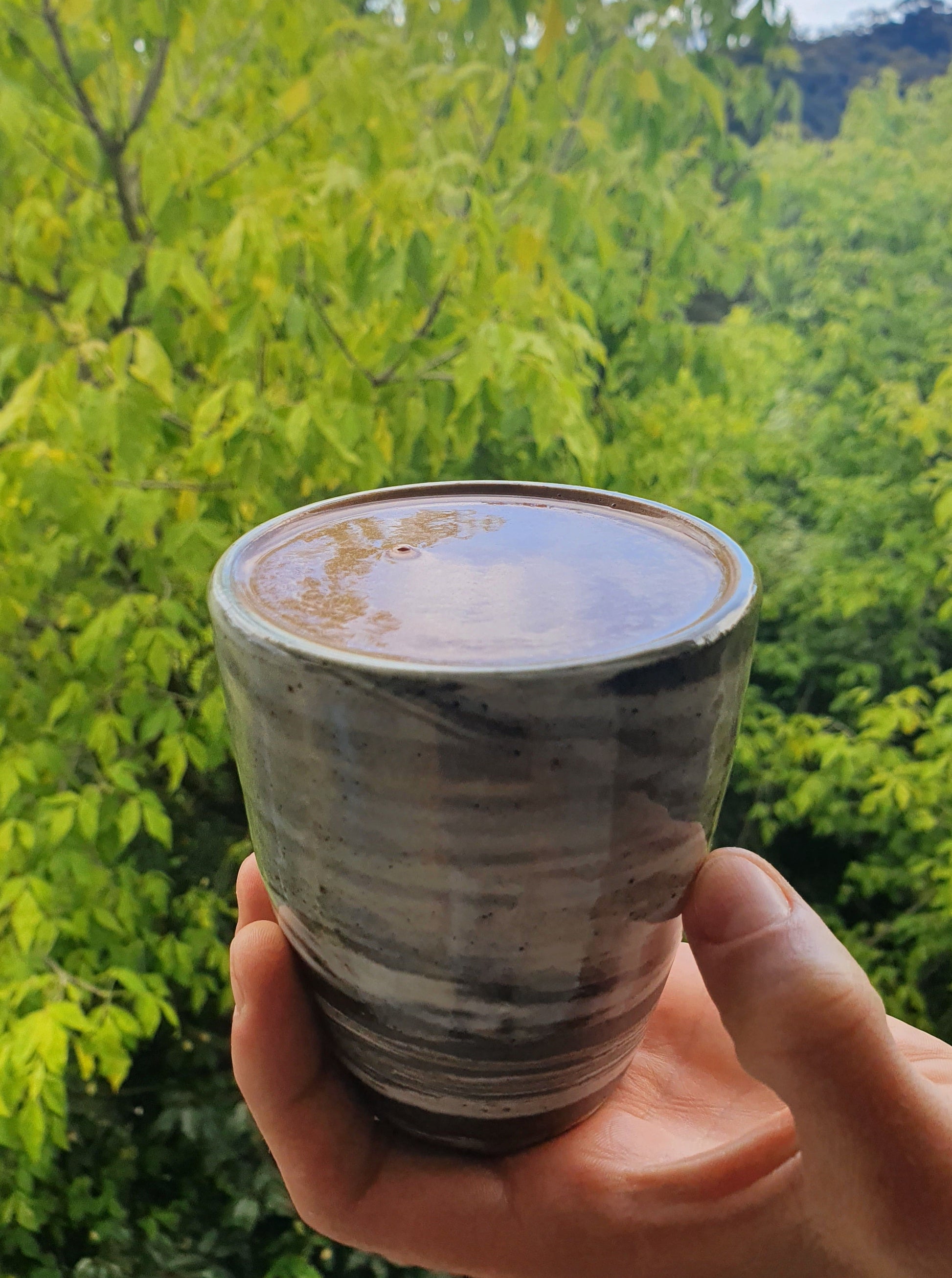 A handmade mug with cacao in it